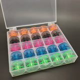 25 coloured bobbins in a box