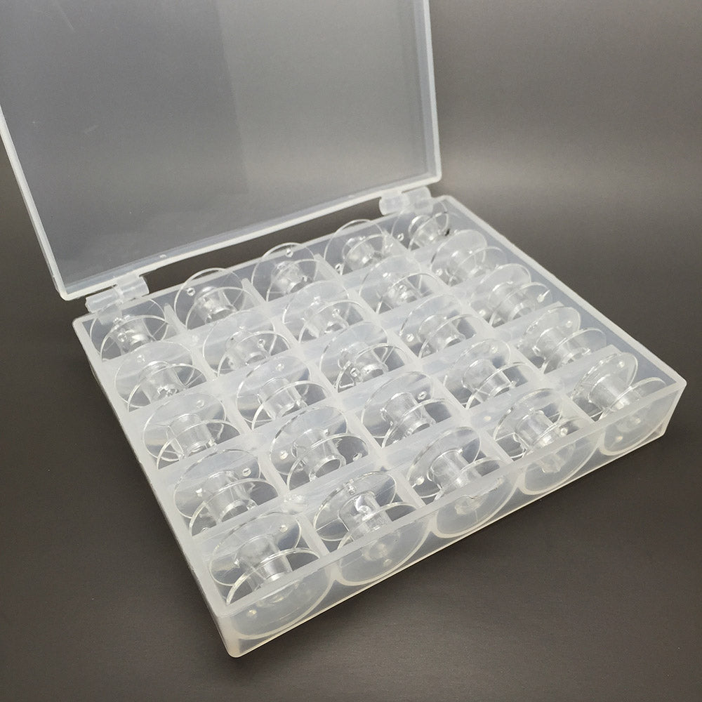 25 Clear bobbins in a box